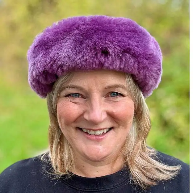 Michelle from Baa Stool wearing a Purple sheepskin headband