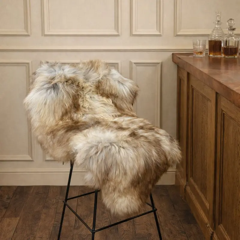 Long wool British Rare Breed Rug 2836 Long wool British rare breed sheepskin rug draped over a metal bar stool in a relaxed bar interior
