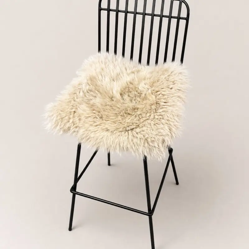 A pair of Sheepskin Seat pads in Eggshell