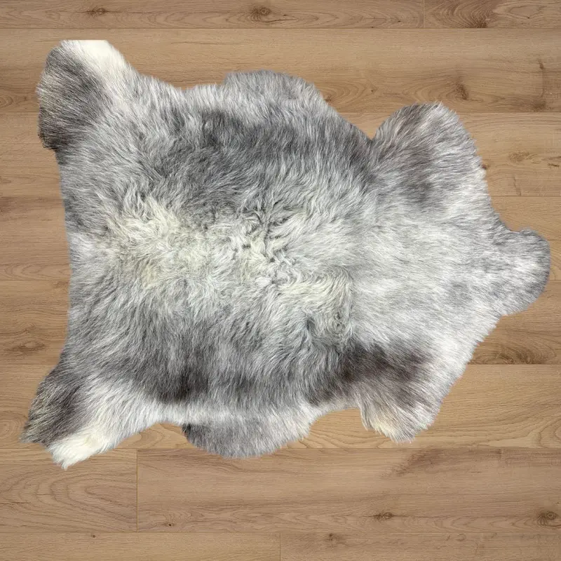 Authentic Herdwick wool rug on wooden flooring with organic colour variation.