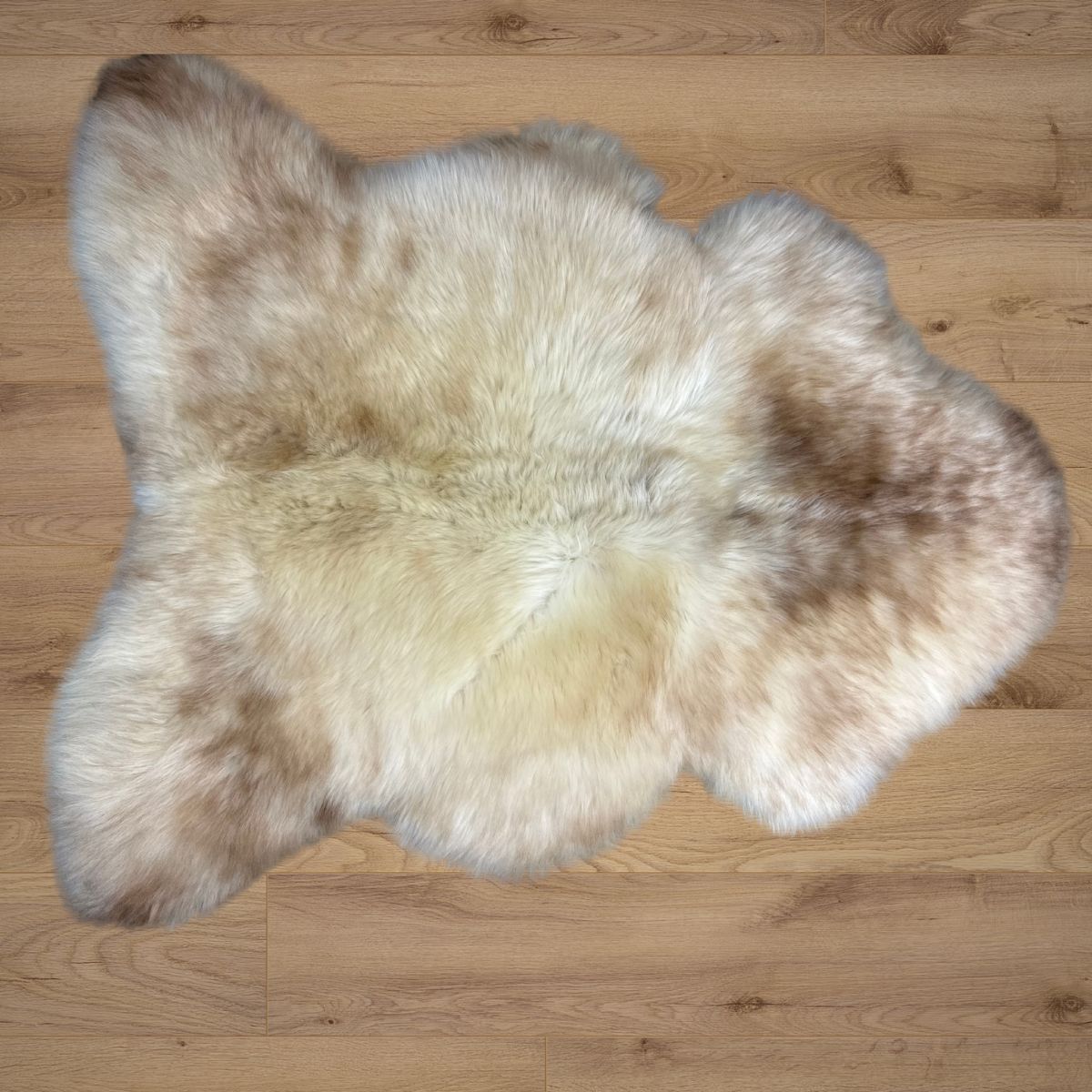 Rare breed sheepskin rug laid on timber floorboards.