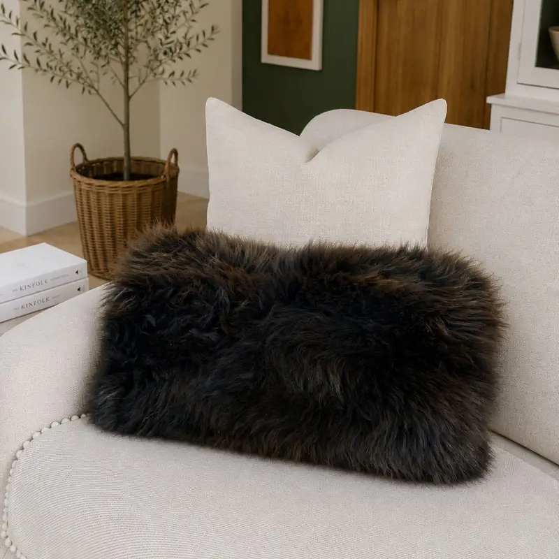 Rare Breed Bolster Cushion 11 on a sofa