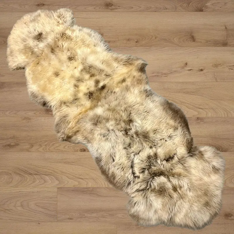 Rare breed double sheepskin rug on a wooden floor.