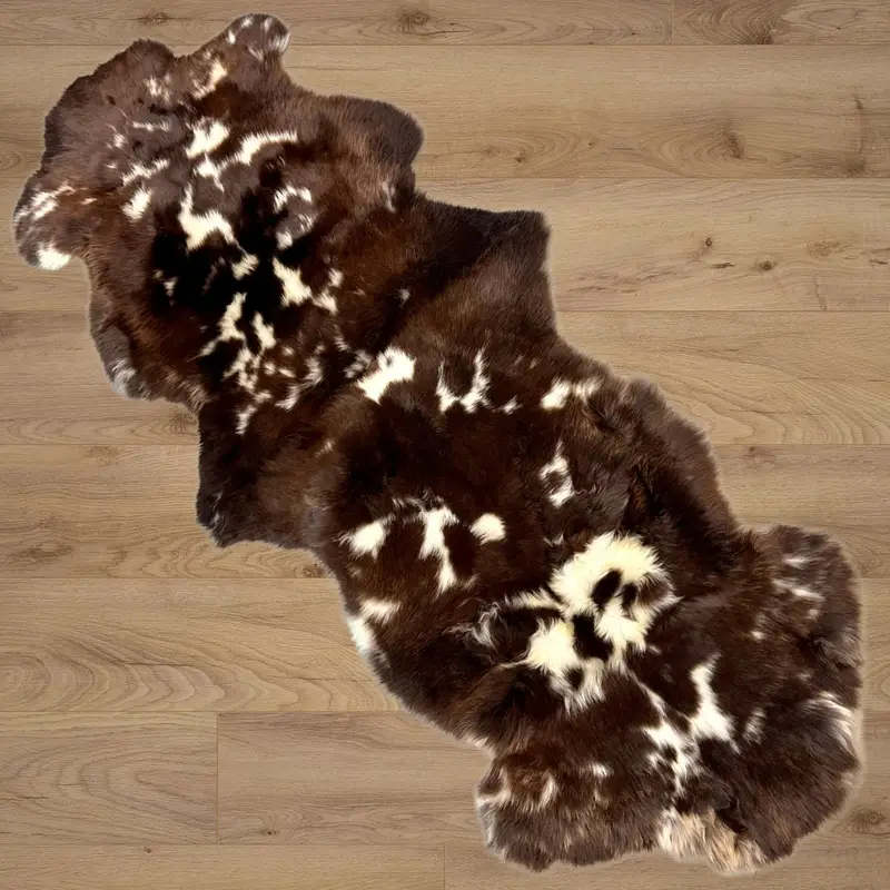 Rare breed double sheepskin rug on a wooden floor.