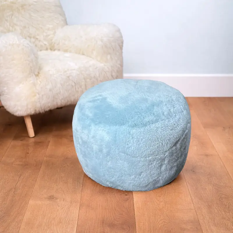 Powder blue velvety sheepskin pouffe handmade in North Wales