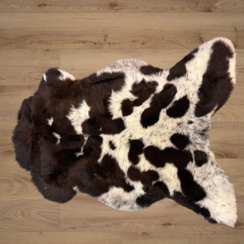 Cow print! Deep mocha with ivory and freckles, such a soft, pretty rug.