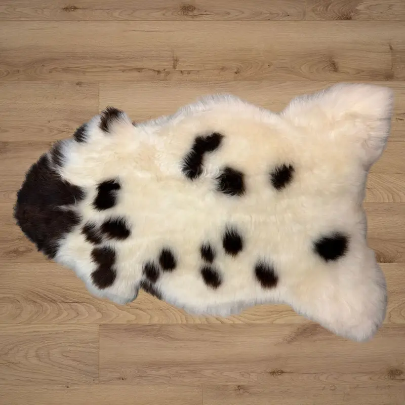 An ivory rug with hazelnut splotches and really soft wool.
