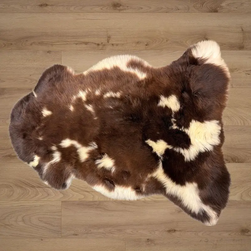 Rich chocolate tones with ivory splotches and a soft and silky texture.