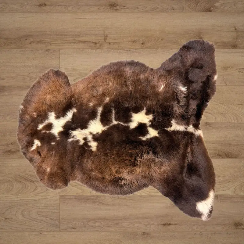 Rich chocolate tones with ivory splotches and a soft and silky pile.
