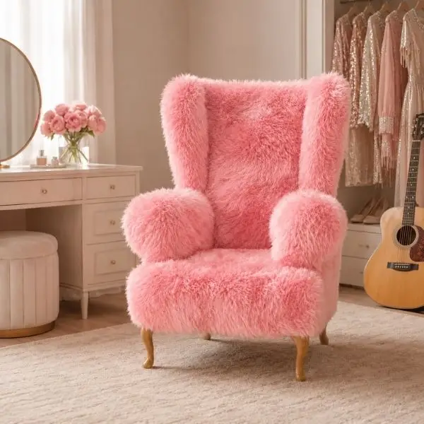 Lifestyle image of Dolly Bear Chair upholstered in baby pink sheepskin, handmade by Baa Stool in North Wales