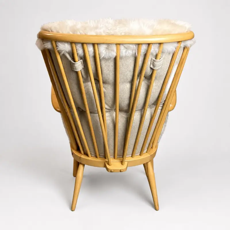 Back of Ercol Jubilee chair showing Seashell sheepskin and Linwood wool cushion