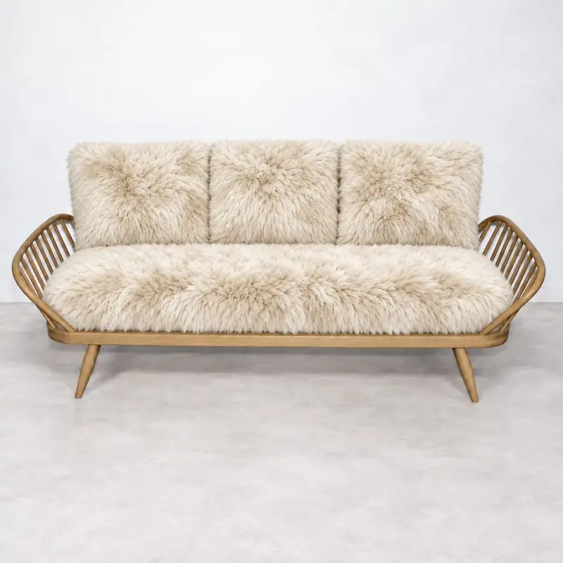 Blonde Ercol Windsor 355 Studio Couch imagined in Eggshell sheepskin