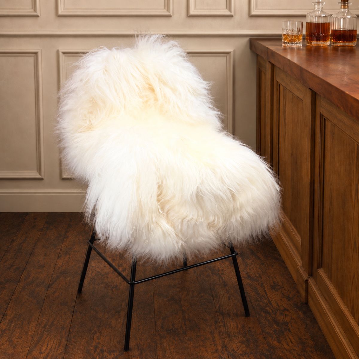 Icelandic rug in ivory on a bar chair by a wooden bar.